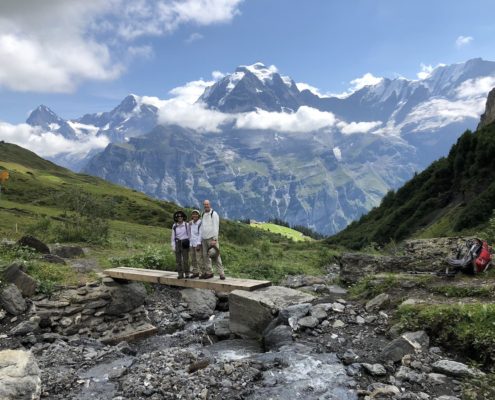 Hikers near Murren in Swiss Alps